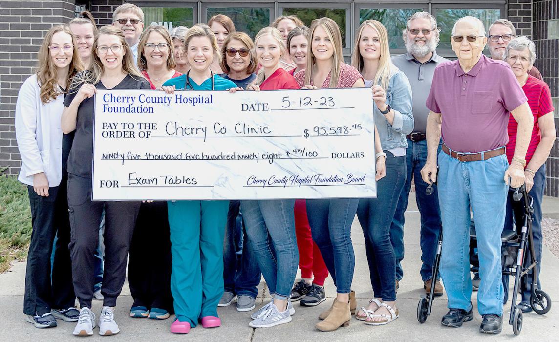 Pictured at the check presentation are back row, L to R: Steve Isom, Kim Shaul, Brandi Thornton, Kristin Jerred, Steve Brown. Middle row, L to R: Heather Stumpff, Annie Osnes, Deb Delaney, Sarah Danielski, S. Rourke Springer, Joan Johnson. Front row, L to R: Taylor Schendt, PA-S, Claire Carr, PA-C, Dr. Madeleine Wilson, Hannah Harwager, Talia Benson, Lacey Joseph, Lew Johnson. Photo by Laura Vroman