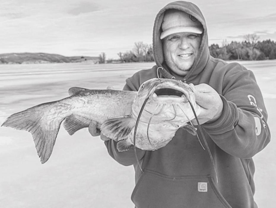 Matt Medlock with a very lovely catfish caught at a previous Cork Thornton Memorial Ice Fishing Tournament. Photo by Laura Vroman