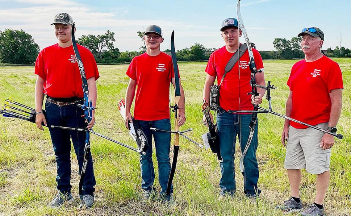Pictured are Dylan Naslund and the Nebraska 4-H Recurve Archery Team, coached by Jeff Goble.