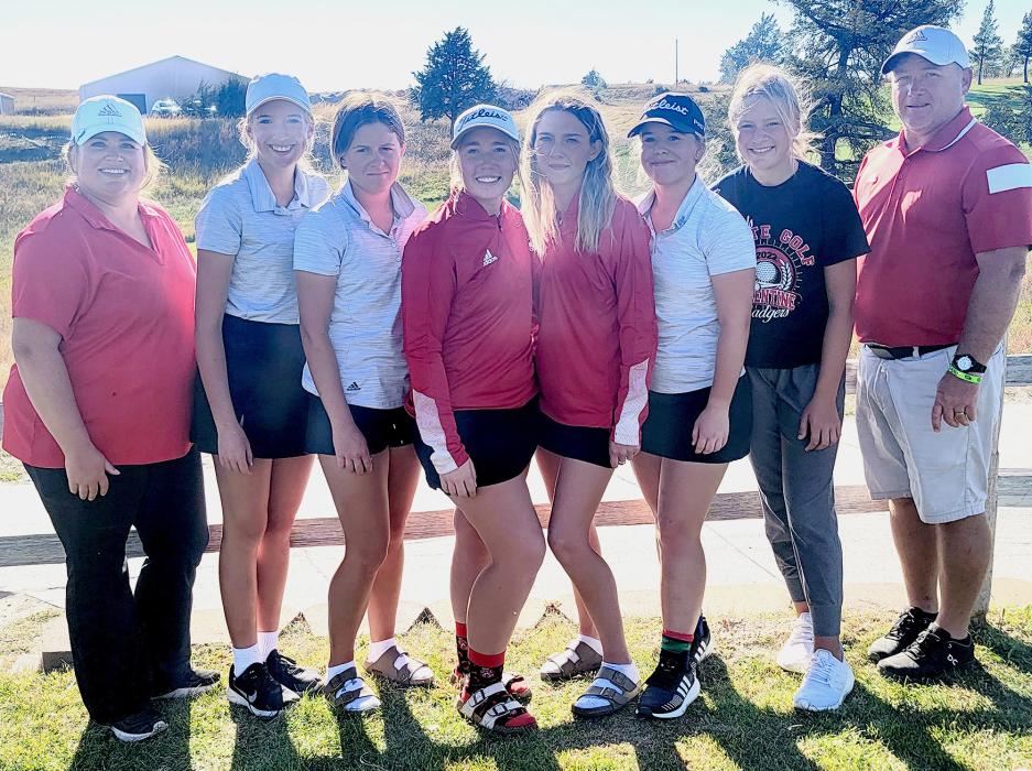 Pictured are from L to R: Coach Houdek, Rylee Wackler, Jocelyn Jordan, Kaylee Hanson, Kaetryn Bancroft, Tierney Miller, Joni Cox, and Coach Muirhead.