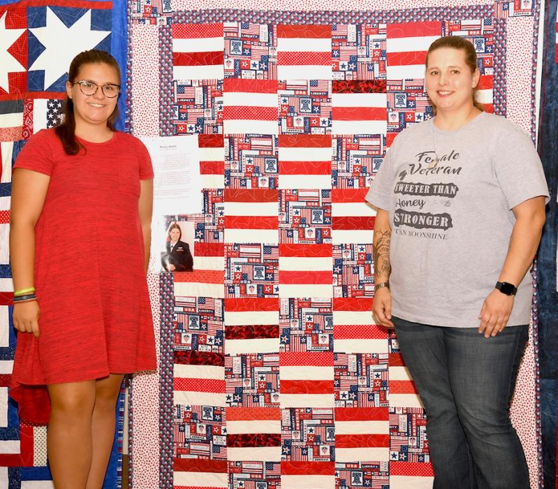 Shyanne Dawson presents Rose Kerns with her Quilt of Valor.