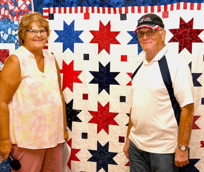 Rhonda Cherry presents Gary Connor with his Quilt of Valor