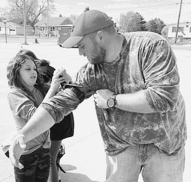 Valentine Police Officer Brandon Ormesher let a student put a tourniquet on him to show how to Stop the Bleed.