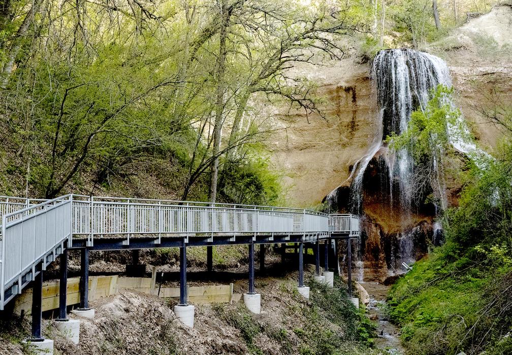 The new boardwalk, constructed of composite decking on a steel frame, leads visitors to Smith Falls. Photo by Justin Haag/NGPC