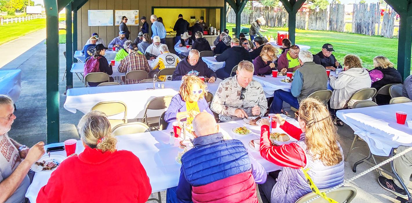Cyclists enjoy a meal catered by Sandhlls Lounge of Long Pine.