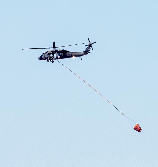 The Air National Guard sent two helicopters who helped douse the flames with water dipped from Merritt Reservoir and private stock dams closer to the fire.