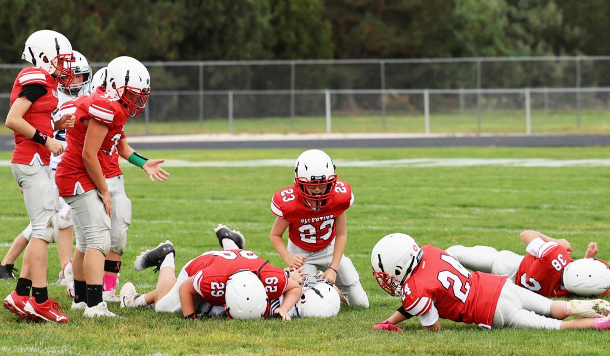 Pictured above, a Sea of Red - Maxx McSweeney# 7 , Sam Osborn #32, Dalton Graham #37, Cooper Connot, Ryker Liddy #38, and Lincoln Bargen #11. Photos by Julie Liddy