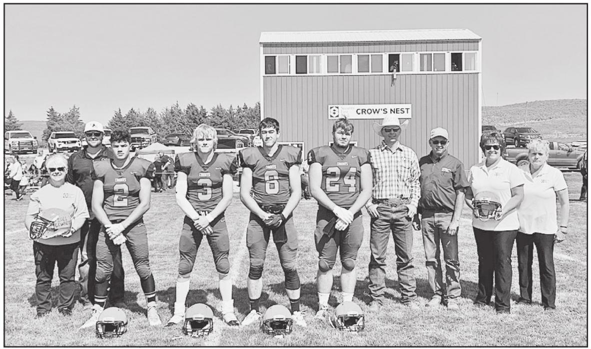 Players from the Cody-Kilgore football team presented Security First Bank employees with two signed helmets in appreciation for the bank’s $10,000 donation. Pictured are L to R: Security First Insurance Barb Davis; Head Coach Landon Miller; senior C-K football players Peyton Sterkel, Cactus Millar, Gage Davis, Tucker Ravenscroft; Security First Bank employees, Tom Cooper, Wes Genkins, Patty Kramer and Loretta Fish.