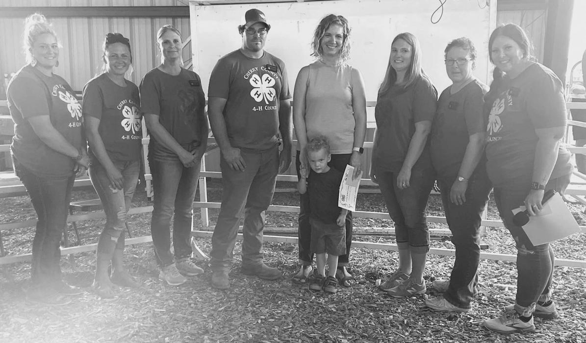 Cherry County 4-H Council members presented Andrea Heinert and Henry from Sandshooters the 4-H Friend of 4-H Business Award.