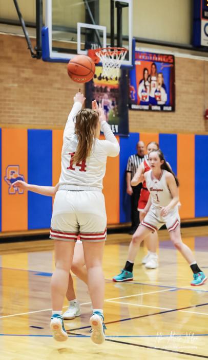 Senior Kimber McGinley #14 one of several 3 pointers she scored in the sub district game.