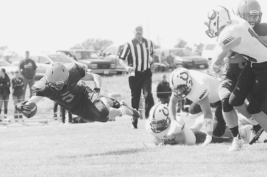 This Cowboy is flyin high and protecting the ball in the game against Stuart. Shontell Roseberry, Owner/Photographer at Shontell’s Smiles