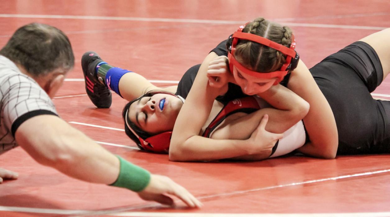 Reegan Eggert gets the pin against the Ainsworth wrestler.