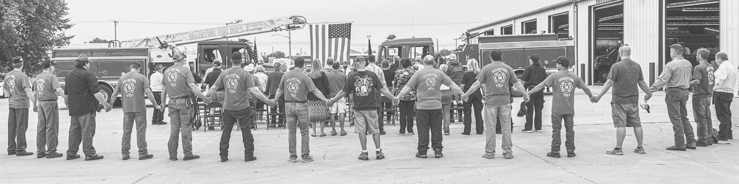 As only Jean Vackiner can...she encouraged a moment of solidarity and asked guests at the 9-11 Remembrance to hold hands while she led them singing God Bless America. Photos by Laura Vroman