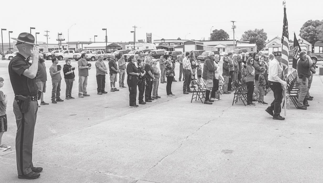 The gathering stood as the Cherry County Color Guard posted the colors.
