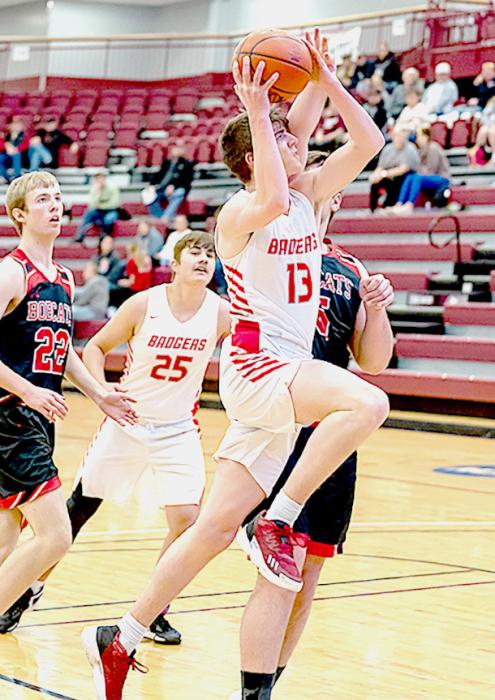 Jack Lancaster #13 goes up for some points in the game over Custer. Photo by Fletcher Larsen
