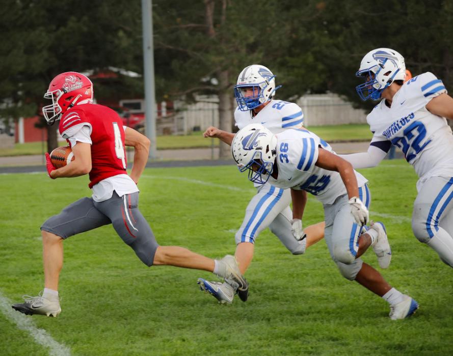 Dominic Beebout makes a TD run in the game against Gibbon. Photos by Nina Maria Nelson