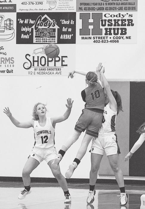 Cowgirl Colby Cady #12 tries to block the shot from Lady Badger Fayth From #10 in the game Tuesday, January 11. Photo by Shontell Roseberry