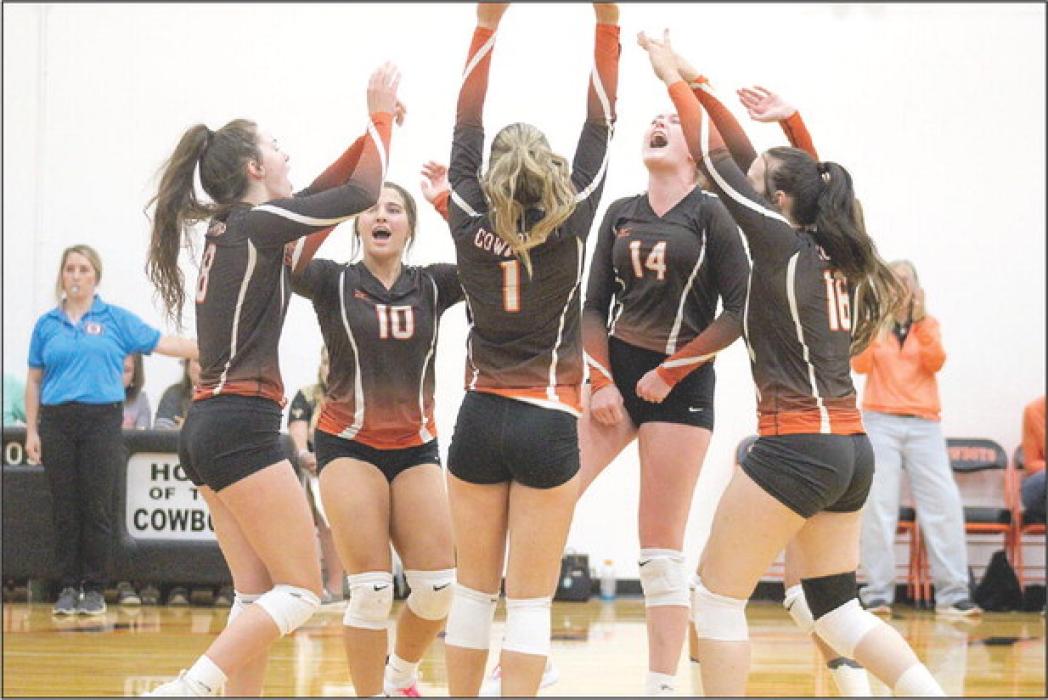 Cowgirls come together to celebrate after a long rally against the Arthur Wolves. Photos by Shontell Roseberry