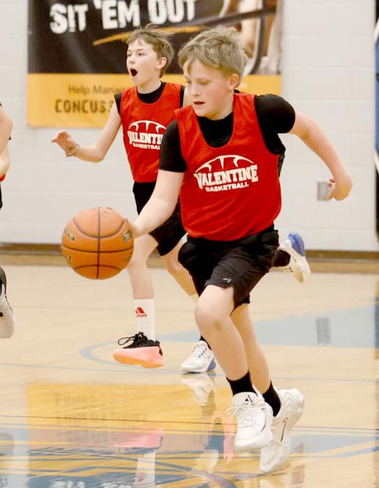 William Weller brining the ball down the court.