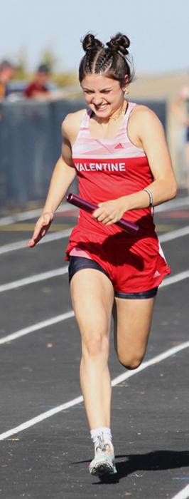 Alivia Patterson competes in the 4x100 Meter Relay where the team took first place. Photos by Amanda Long