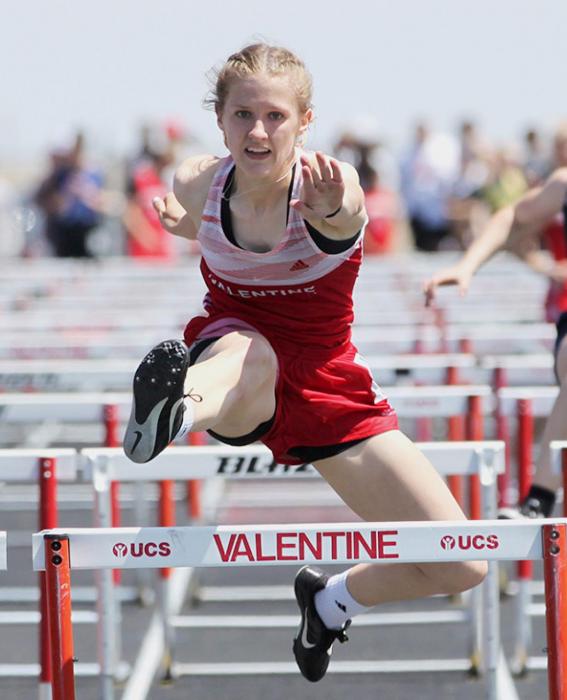 Becca McGinley competes in the 100 Meter Hurdles where she placed first.