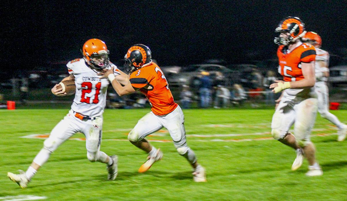 Jasper Roseberry #21 with eyes on a first down, getting by a Crawford Ram.