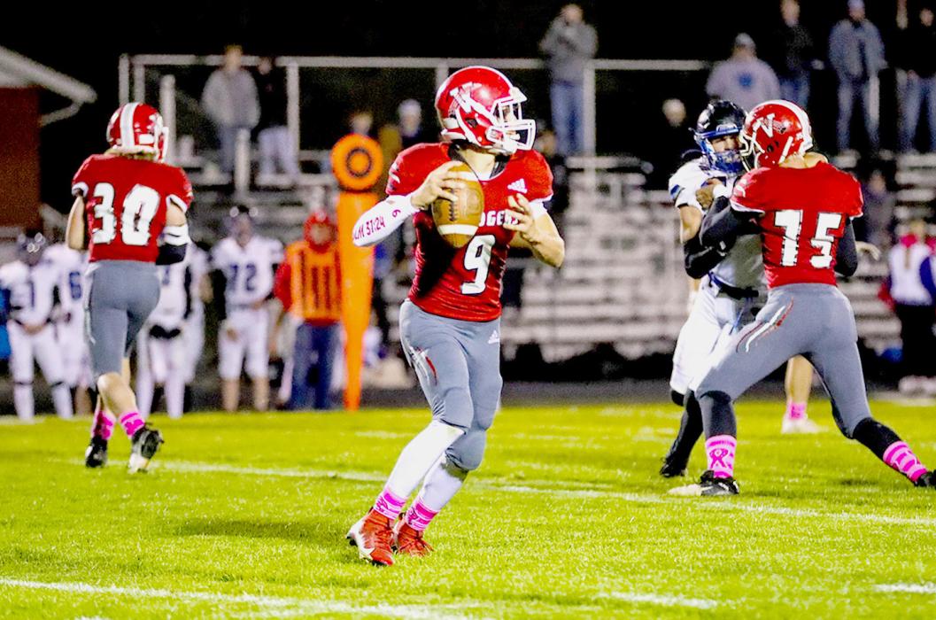 Trace Buechle #9 QB passing the ball in the game against Hershey.