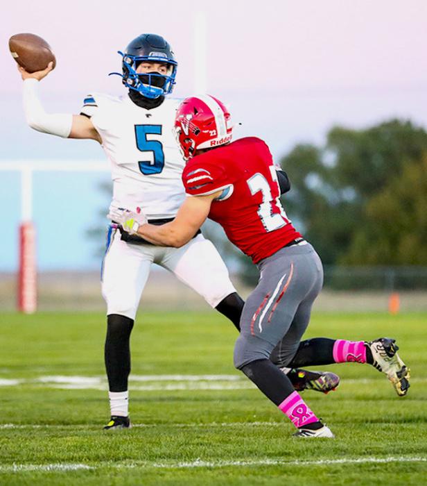 Jordan Bailey #22 rushing Hershey QB. Photos by Nina-Maria Nelson