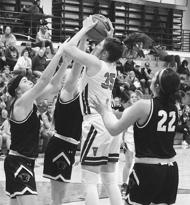 Kinsey Buechle #35 attempts a basket while heavily guarded by the Hershey Panthers, Friday, January 14, 2022. Photo by Mary Reagle