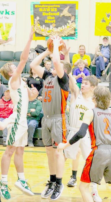 Dylan Naslund putting up a shot against Hay Springs.