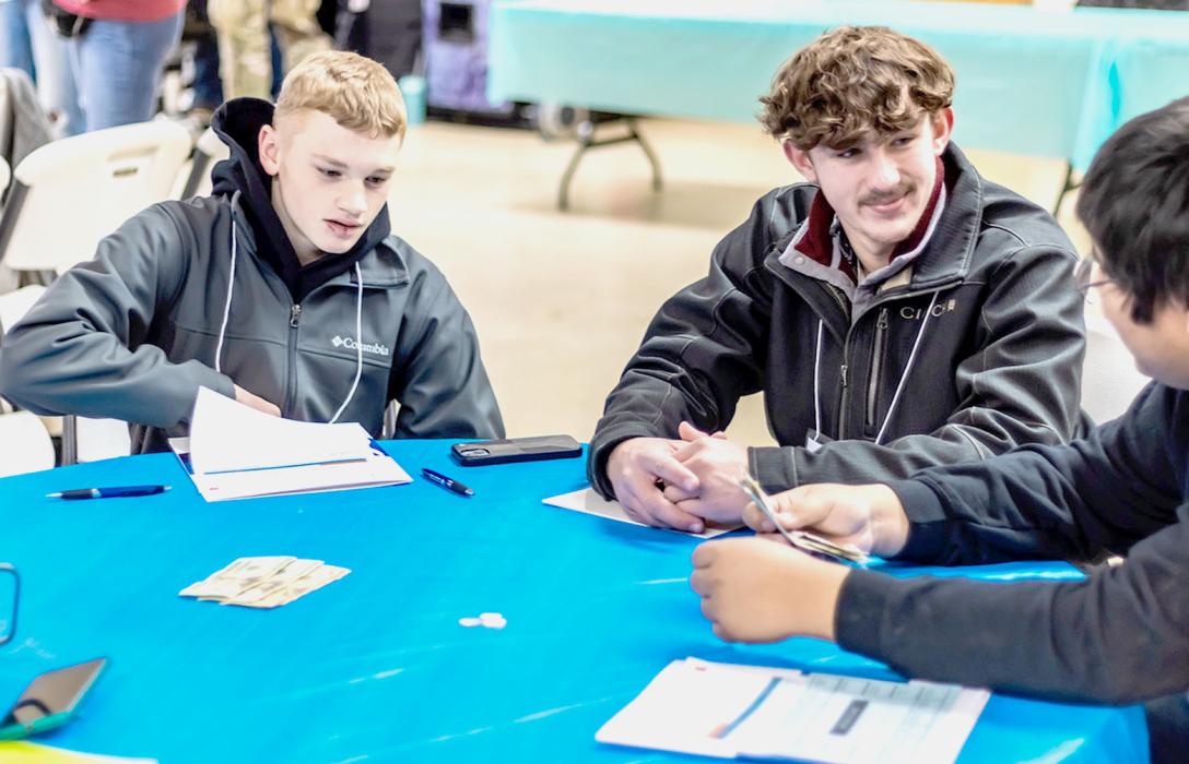 These Valentine students - with the money in the middle of the table - were learning the fine art of counting back change.
