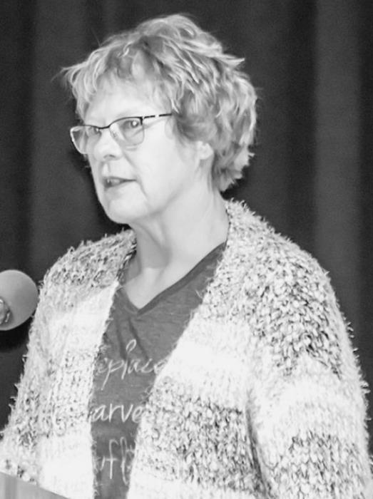 Jody Hronek read a scripture and had those gathered join her in the Lord’s Prayer.