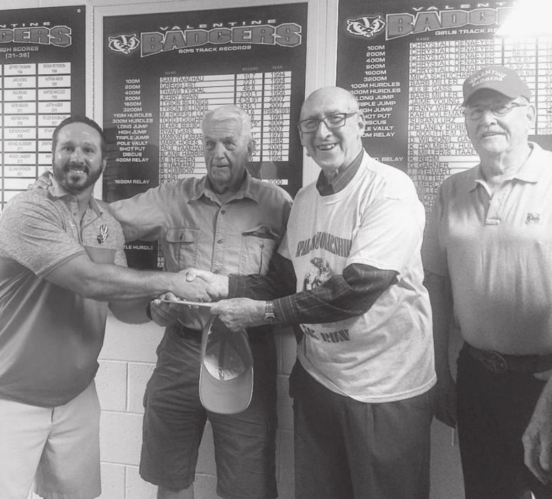 Coach Beebout accepts donation from Spain