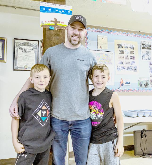 Kade, Kurt, and Kase Arganbright came down to the Vets Club to see the Poppy Posters, including Kase’s which is right above his dad’s shoulder.