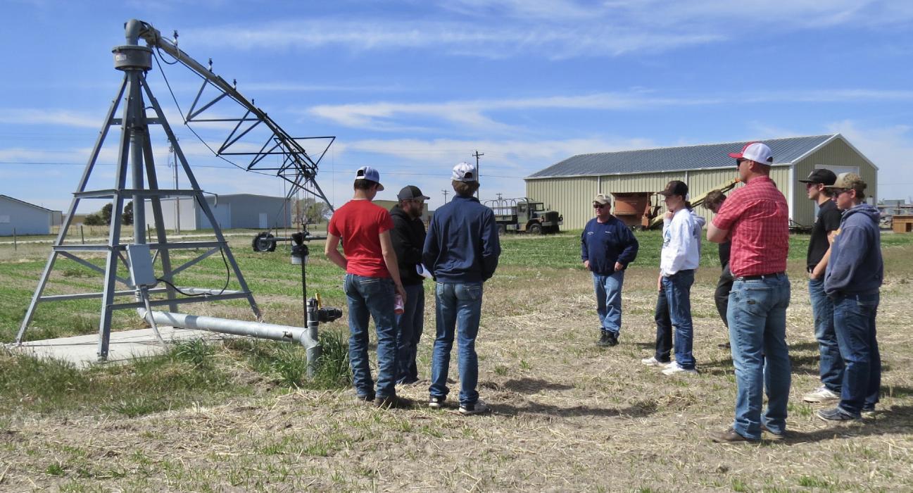 Mike Murphy and Kyle Temple are discussing pivot attributes and how they water different areas of ground coverings to the VHS FFA students. Photos by Tina Boone