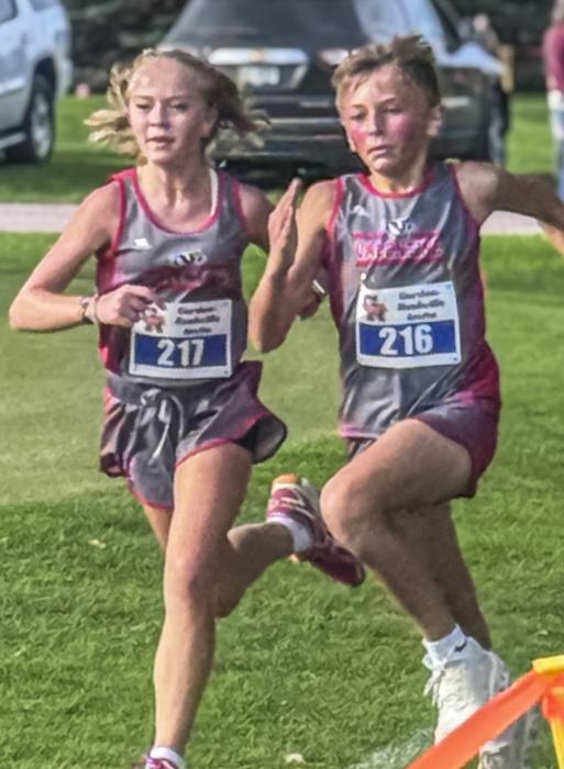 Amelia Wonnenberg and Gunnar Fernau fight to see who can finish first at the Gordon-Rushville Invite. Amelia earned her first medal of season by placing 10th for the middle school girls while Gunnar placed 13th for the middle school boys.
