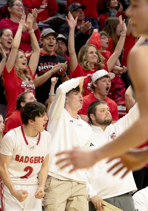 Trace Buechle, Isaac Cronin, and Coach Ben Shelbourn with the bench celebration.