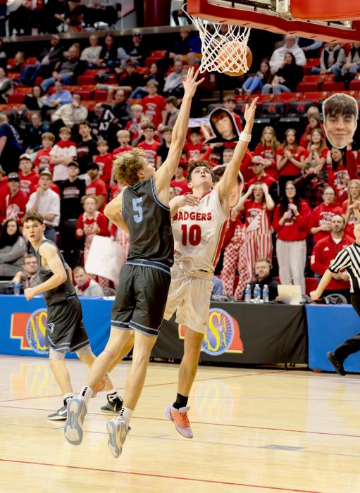 Caden Stankoski with the contested layup.