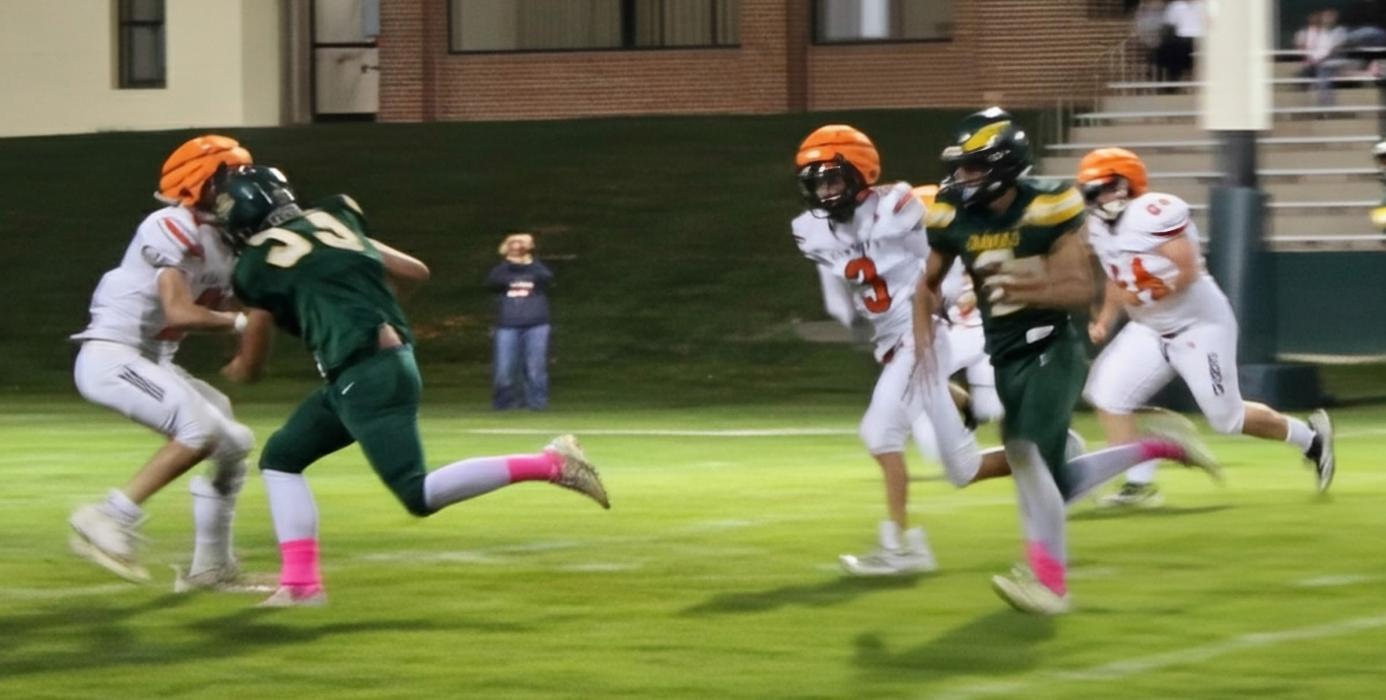CK senior Kaden McNare #2, junior Wesley Willert #24, and Teagen Fish #3 cannot contain Hay Springs junior Tripp Buettner streaking in the open field in 6-man football action in Hay Springs, NE.