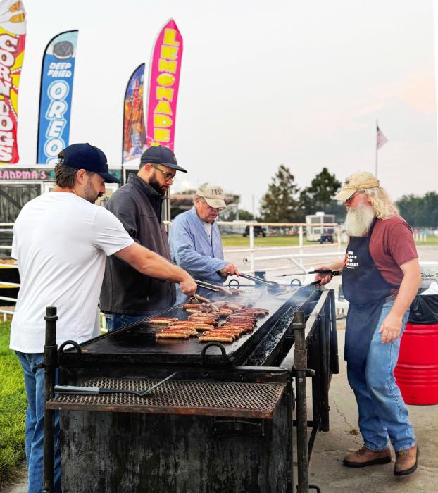 Pictured manning the grill are Foundation members Eric Hofferber, Jud Hoffschneider, Steven Isom, and Rourke Springer.