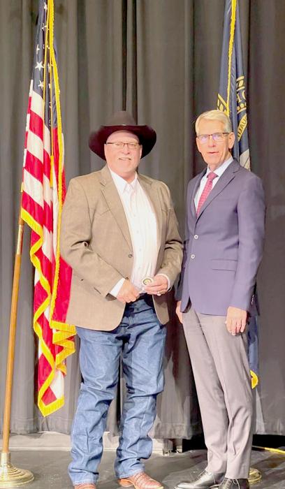 Officer Frank Miller was celebrated for his 25 years of service with a commemorative 25 year coin by Lt. Governor Joe Kelly.