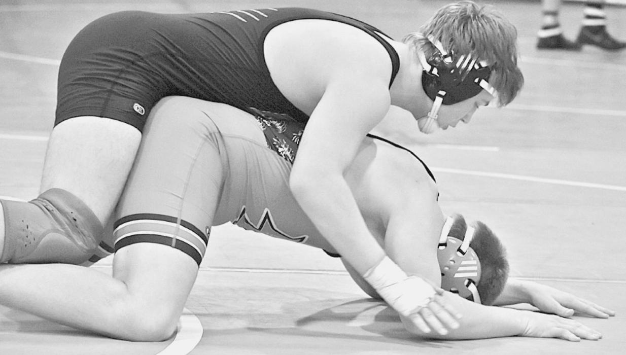Clayton Elliott took fifth place in the 195 pound weight class where he won by a 10-5 decision over Braxgton Janda of Minden. Photos by DeanNa Fowler