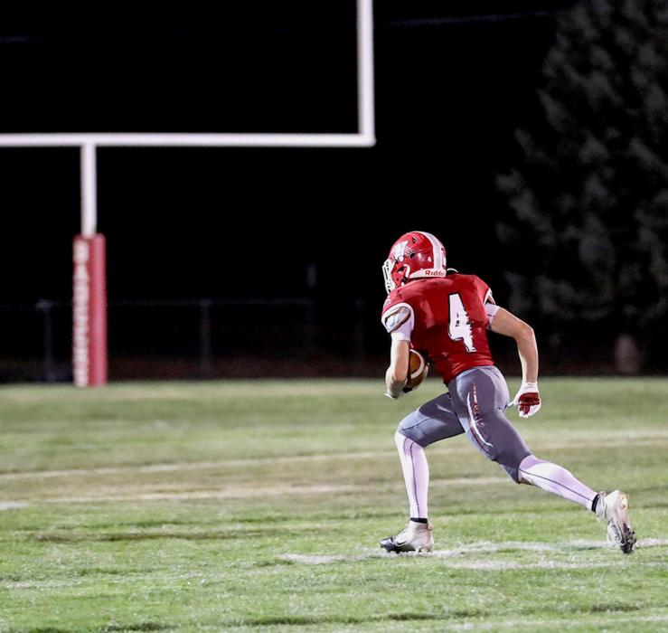 Dominic Beebout heads toward the uprights for a TD. Photos by Nina Maria Nelson