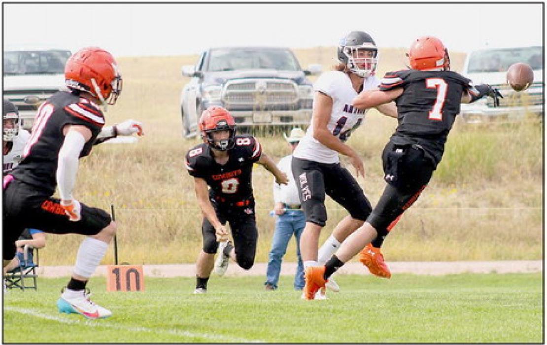 Drew Farrell #7 wreaking havoc on Arthur County's quarterback!