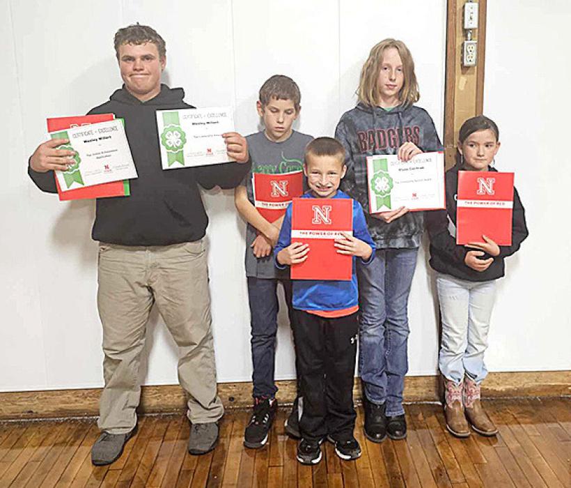 Achievement Record Books and Project winners L to R: Wesley Willert - also Top Leaders Award, Tyson Cochran, Case Larson-Talich, Elyse Cochran - also Top Community Service Award, and Ava Rahn.