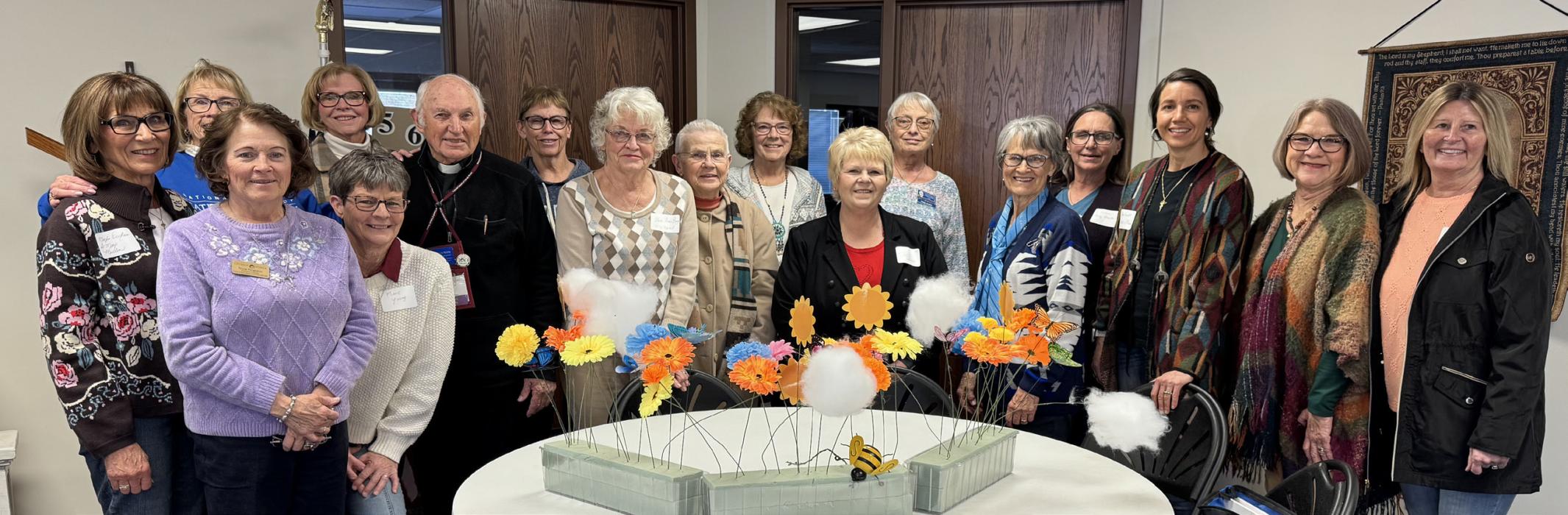 Attending the North Platte Spring Deanery meeting included, back row, L to R: Marylin Ericksen, Sandy Eggert, Loretta Hamilton, Kathy Hassett, Linda Wilkinson, Cindy Dunbar, Cindy Frey, Front row, L to R: Patricia Ferguson, Marie Young, Rev. Louis Nollette, Dee Bayer, Karen Becvar, Echo Pelster, Susan Johnson, Alena Arendt, Sherry Weatherly, Tami Pierson.