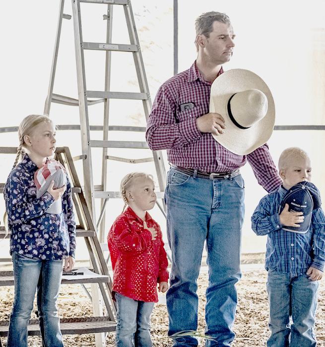 Teaching the next generation the proper way to honor the flag when saying the Pledge of Allegiance.