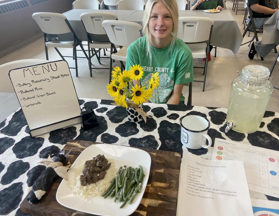 Christen Larson-Malard showcases her rosemary-flavored steak bites that she cooked live in front of the judge!