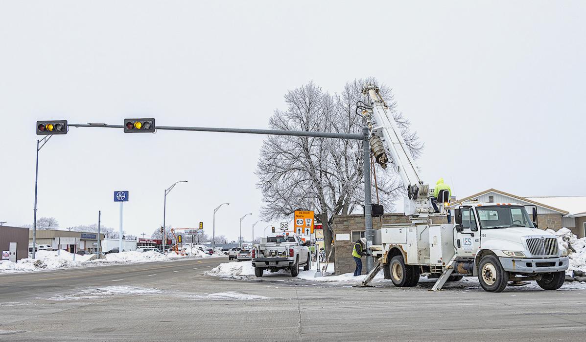 At the intersection of Main Street - Highway 83, and Highway 20, IES works on wiring the traffic signals. Photo by Laura Vroman