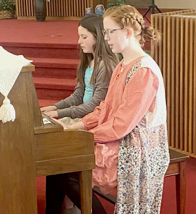 Piano Duet with Brooke Brashears, front, and Emillia Ward, back.